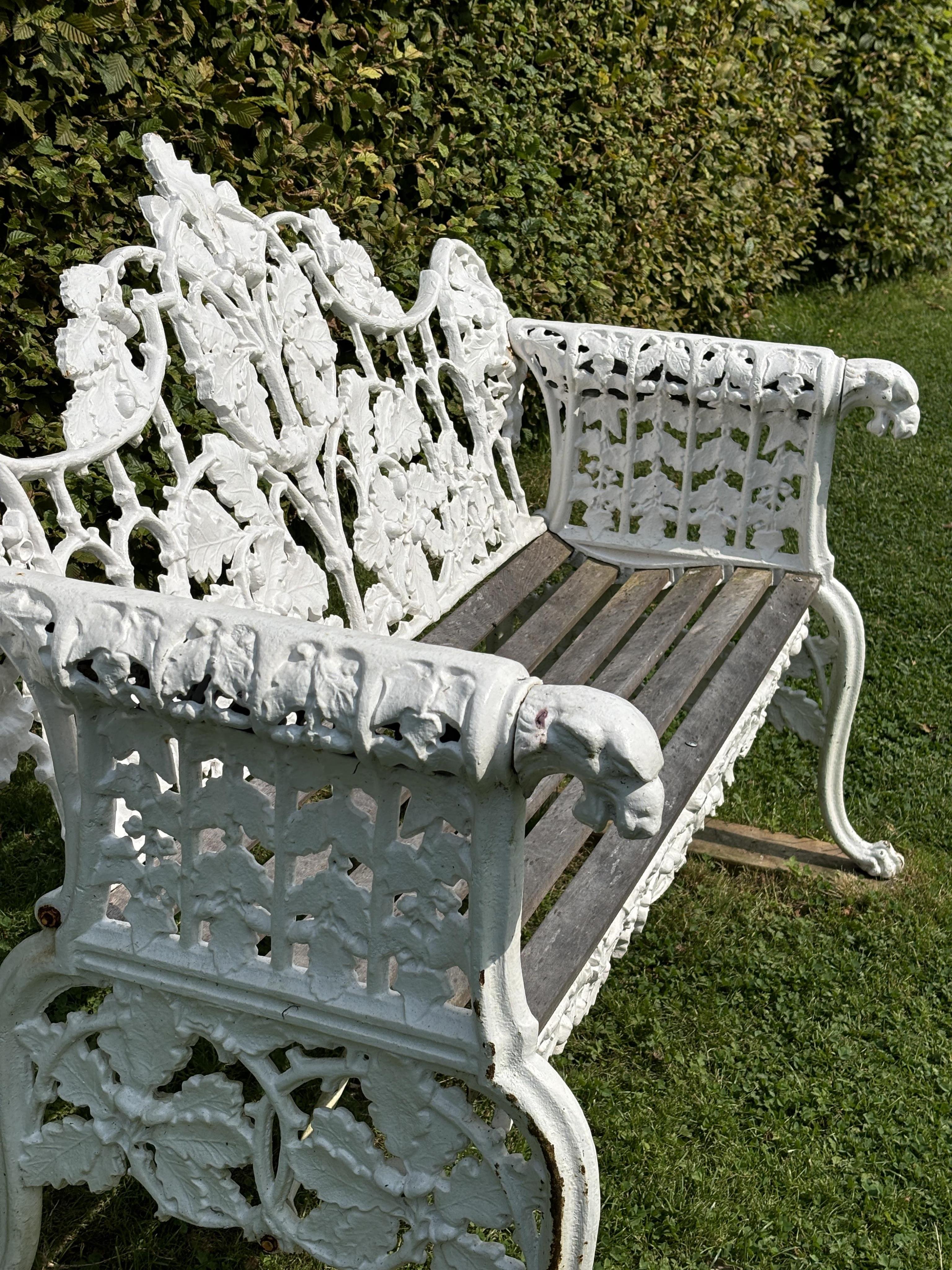 A pair of Coalbrookdale style cast iron garden benches